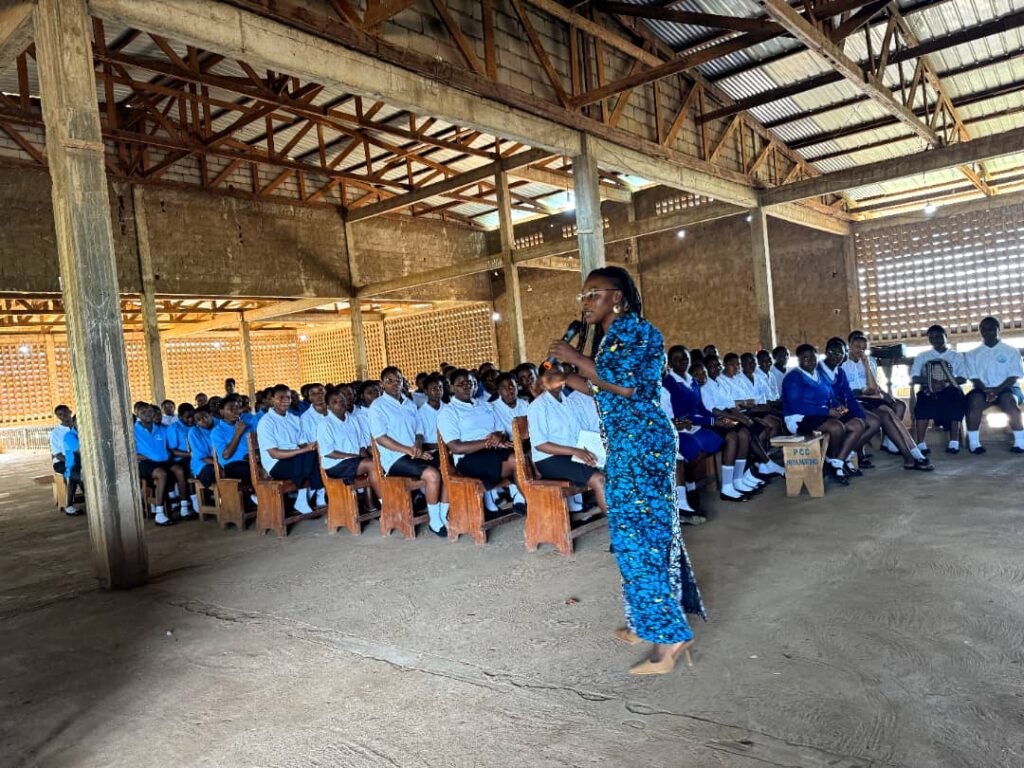 Sisterspeak237 founder Comfort Mussa talking to girls in CCSS Nkolmbong