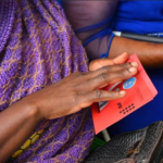 (Photo via ELECAM: visually impaired with braille ballot)