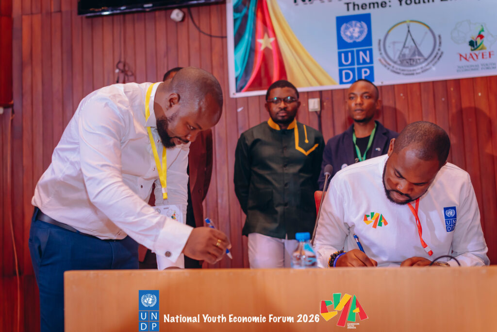 Ngwane Denzel alongside Richard Atem-Ojong signing Youth Economic Commitment